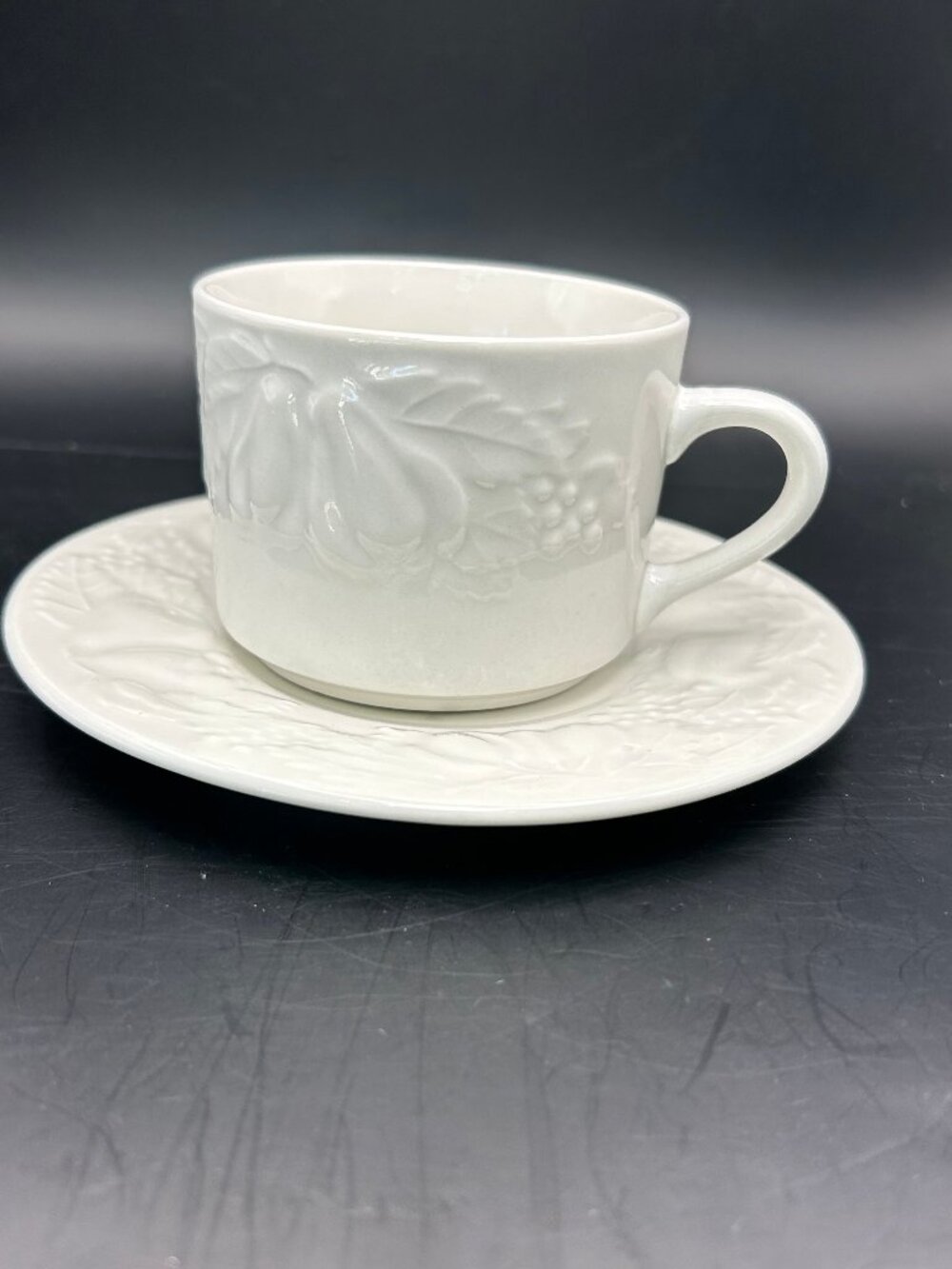 Tabletops Unlimited Fruit De Blanc Cup and Saucer Set - White Embossed Fruit